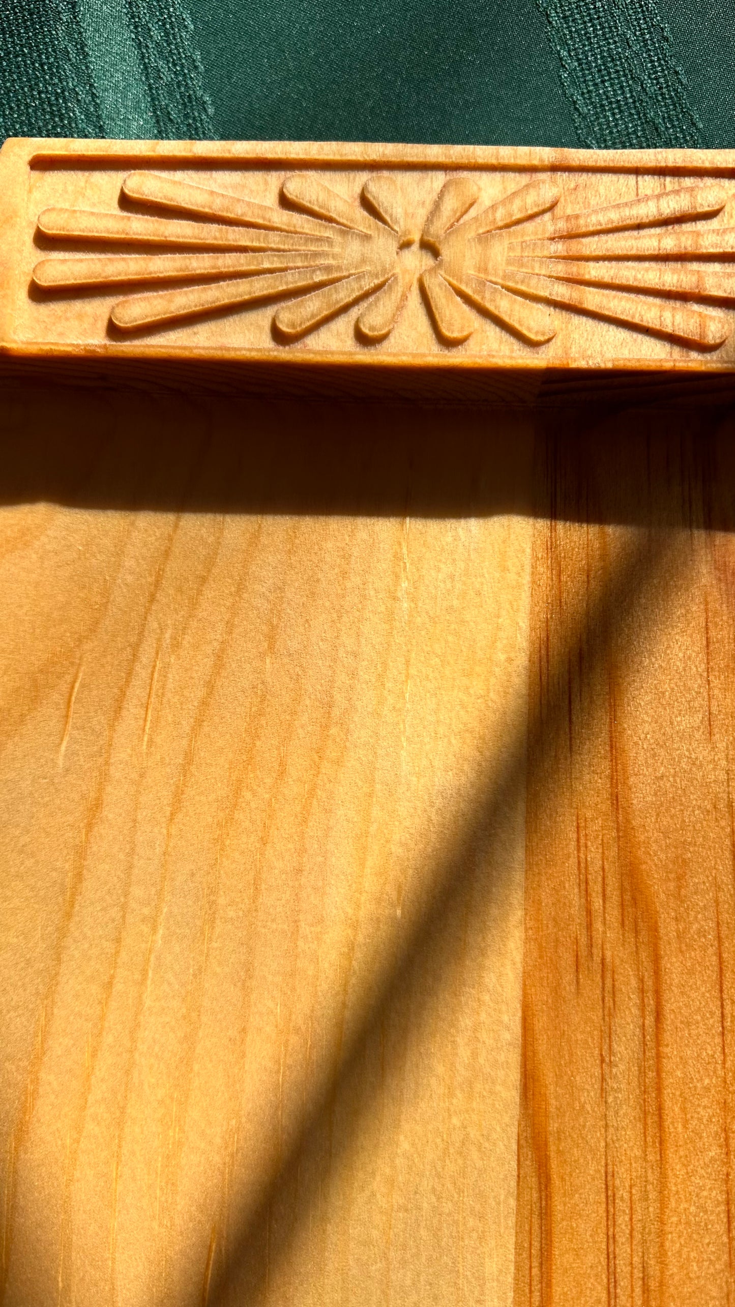 The rosette in the morning sun looks as if it's spreading the sun's rays across the board.